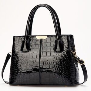 New patent leather top handle handbag crocodile pattern with removable strap.